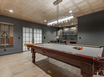 Finished basement recreation room in an Omaha home remodeled by Gottsch Construction