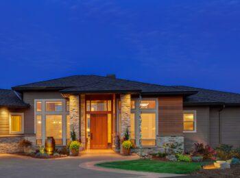 Modern custom ranch home exterior at dusk in Omaha, Nebraska