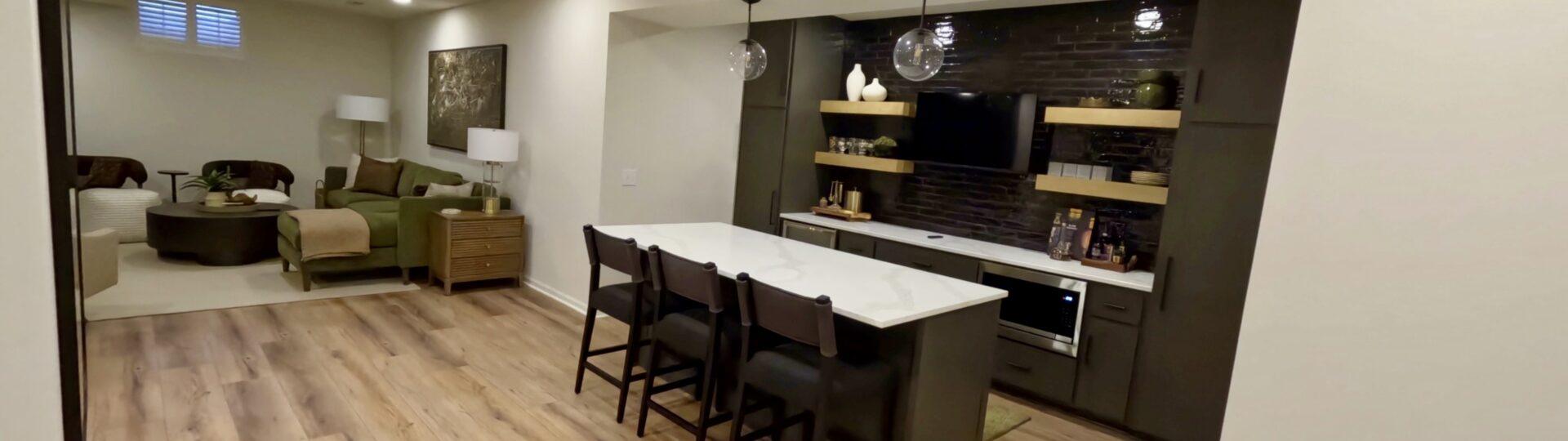 Finished basement with wet bar and open living area in Omaha